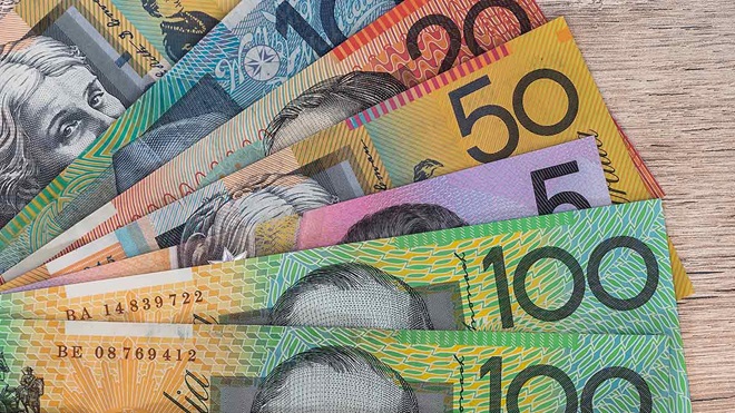australian money notes on a table